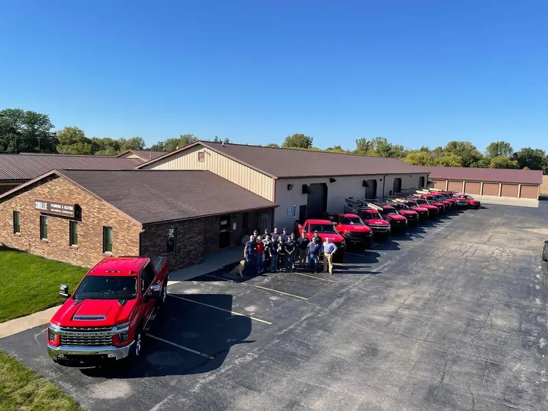 The Smillie Mechanical crew and service fleet outside the Pierce Road shop in Freeland
